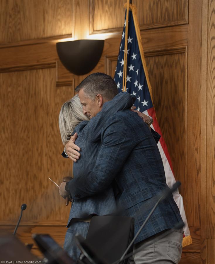 Paul TenHaken embracing newly elected Mayor Christine Erickson at the handoff, photographed by Lloyd Duimstra, Sioux Falls SD