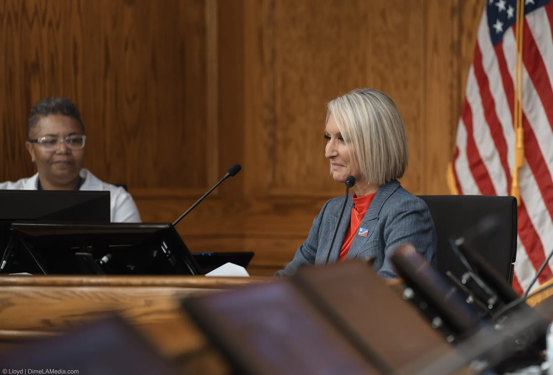Mayor Christine Erickson seated at the dais beside the American flag for the first time