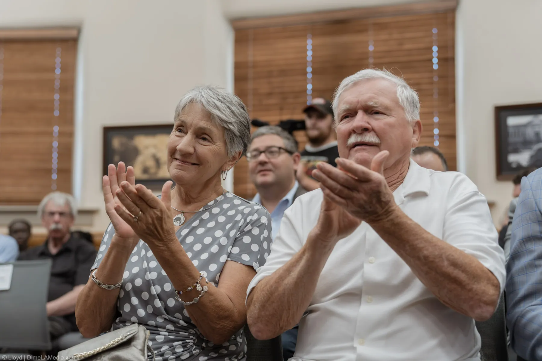 Family members applaud from the front row during the inauguration ceremony