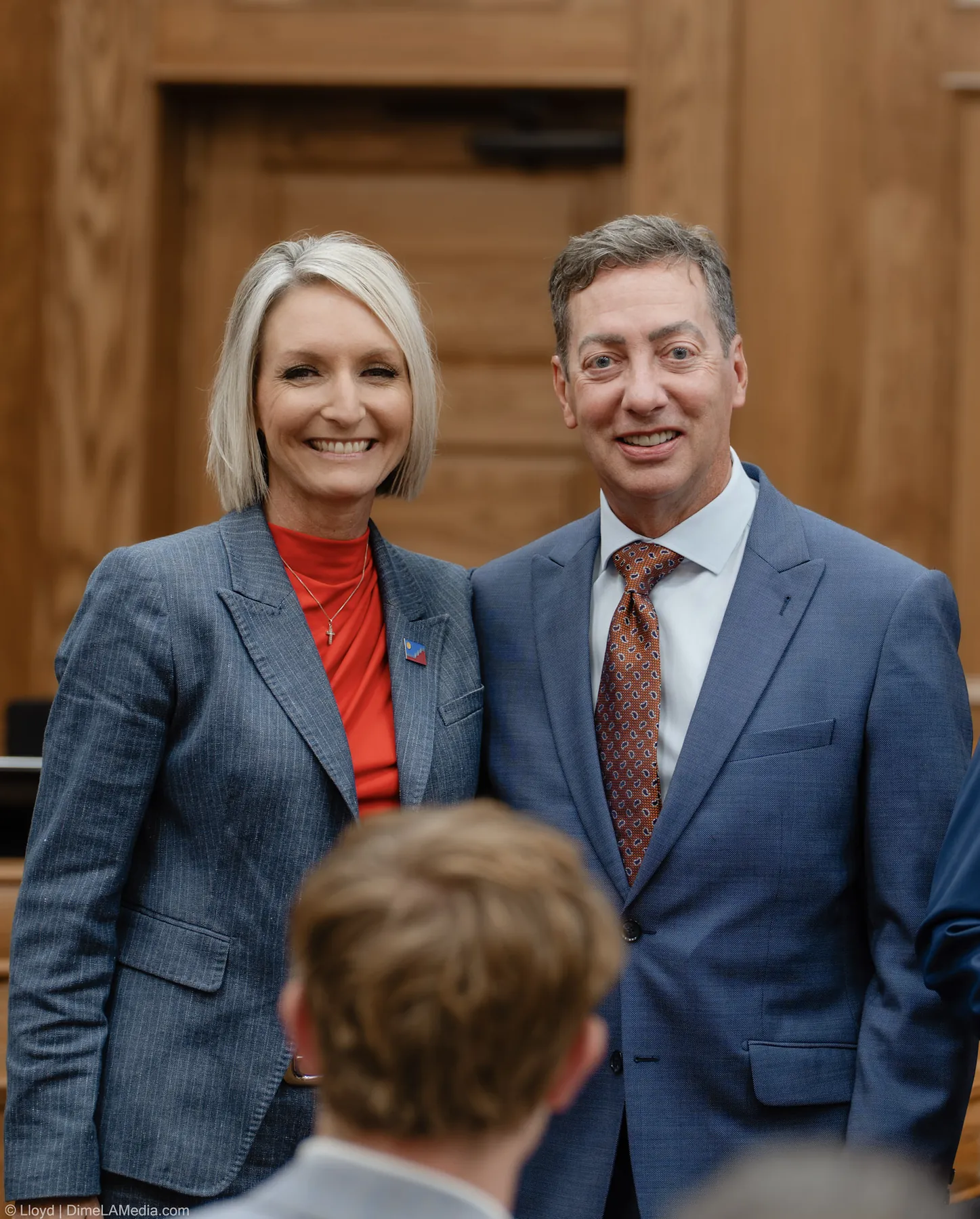 Christine Erickson stands for a portrait with a guest before the swearing-in at Carnegie Town Hall