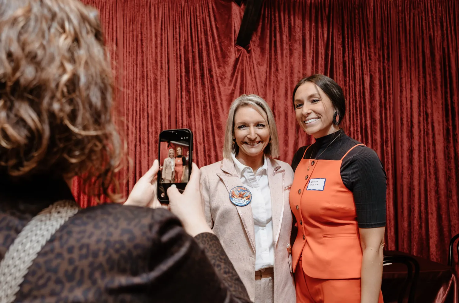 Christine Erickson poses with a guest at a community event during the campaign in Sioux Falls