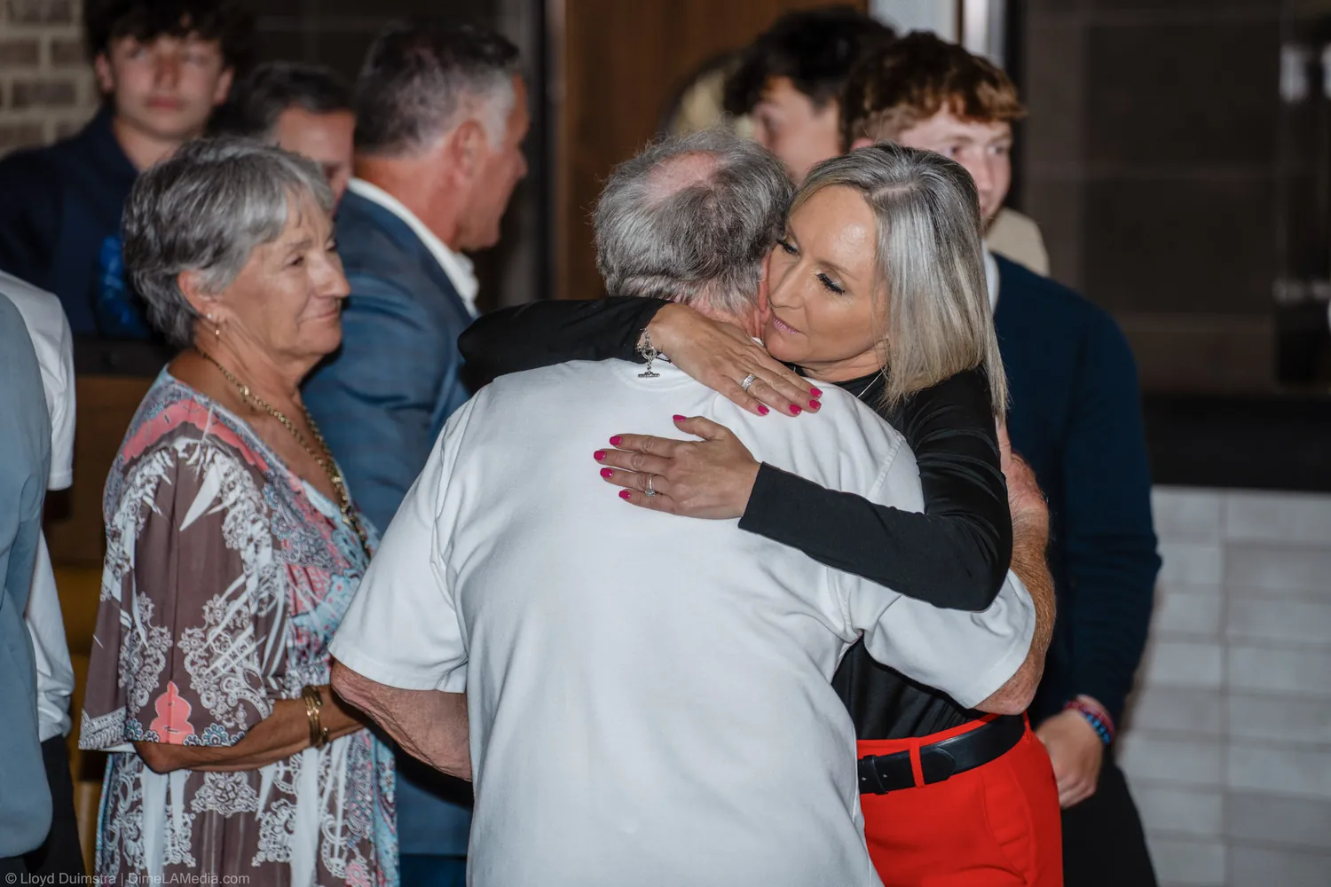 Christine Erickson embraces a supporter after her victory speech on election night