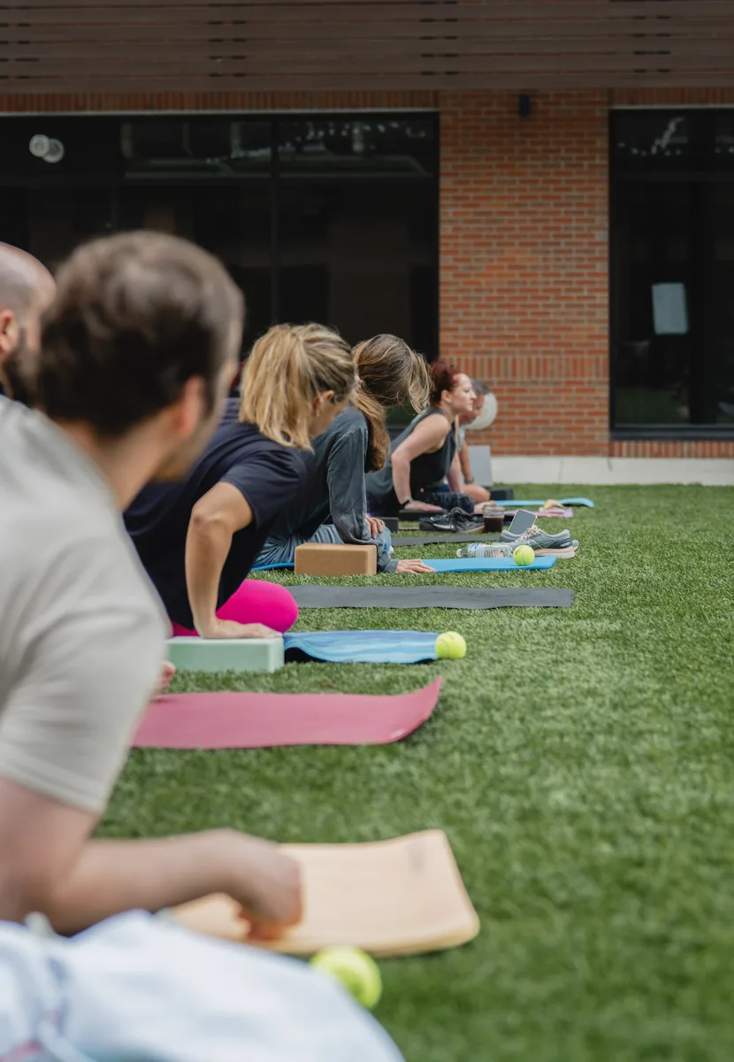 Outdoor Kinstretch class hosted by Sisu and Pomegranate Market, photographed by Lloyd Duimstra at Cherapa Place in downtown Sioux Falls SD