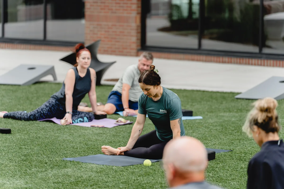 Outdoor Kinstretch class hosted by Sisu and Pomegranate Market, photographed by Lloyd Duimstra at Cherapa Place in downtown Sioux Falls SD