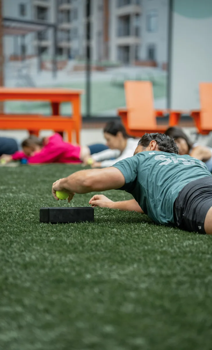Outdoor Kinstretch class hosted by Sisu and Pomegranate Market, photographed by Lloyd Duimstra at Cherapa Place in downtown Sioux Falls SD