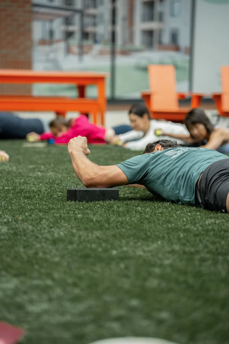 Outdoor Kinstretch class hosted by Sisu and Pomegranate Market, photographed by Lloyd Duimstra at Cherapa Place in downtown Sioux Falls SD