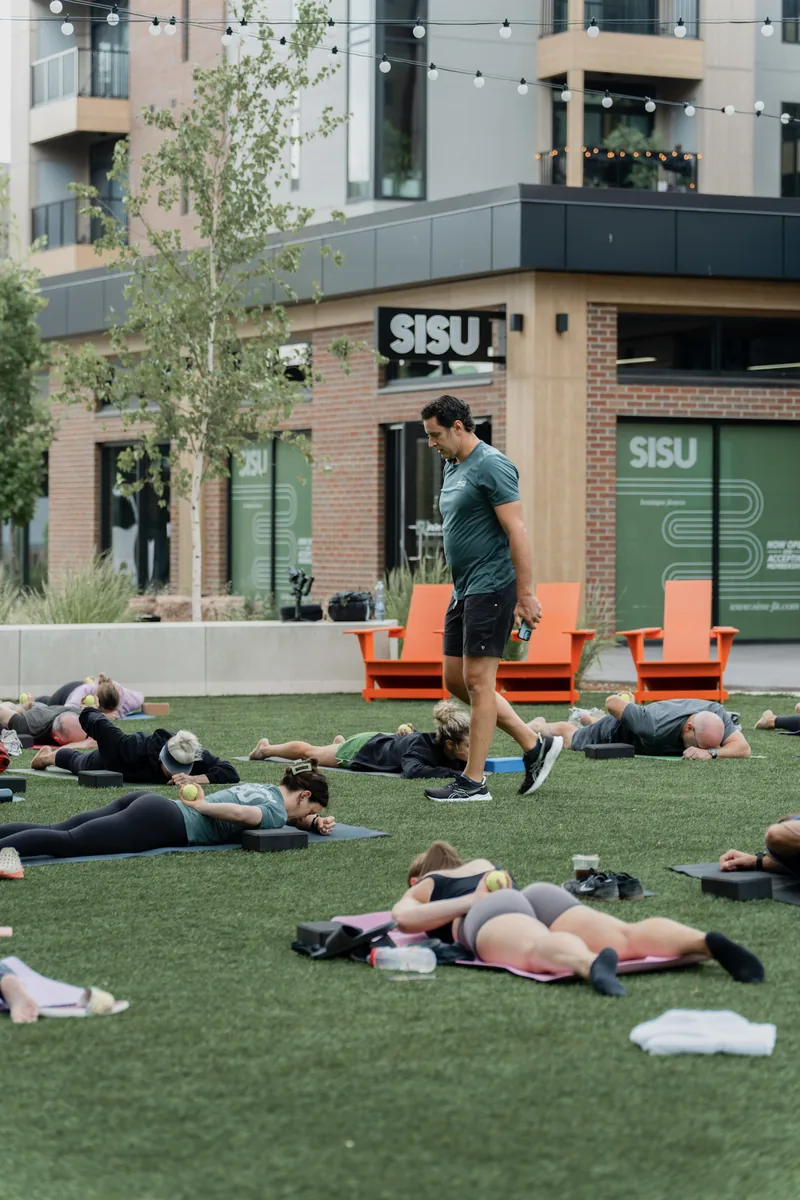 Outdoor Kinstretch class hosted by Sisu and Pomegranate Market, photographed by Lloyd Duimstra at Cherapa Place in downtown Sioux Falls SD