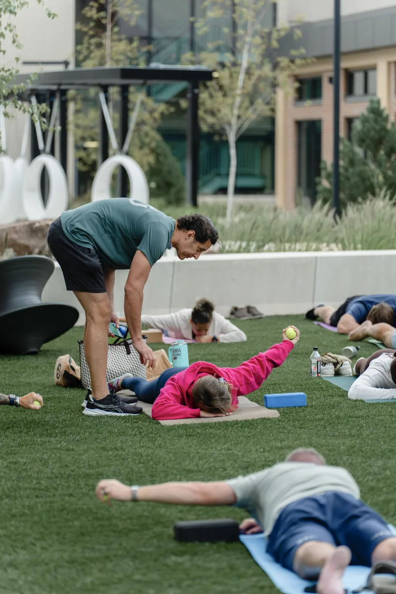 Outdoor Kinstretch class hosted by Sisu and Pomegranate Market, photographed by Lloyd Duimstra at Cherapa Place in downtown Sioux Falls SD