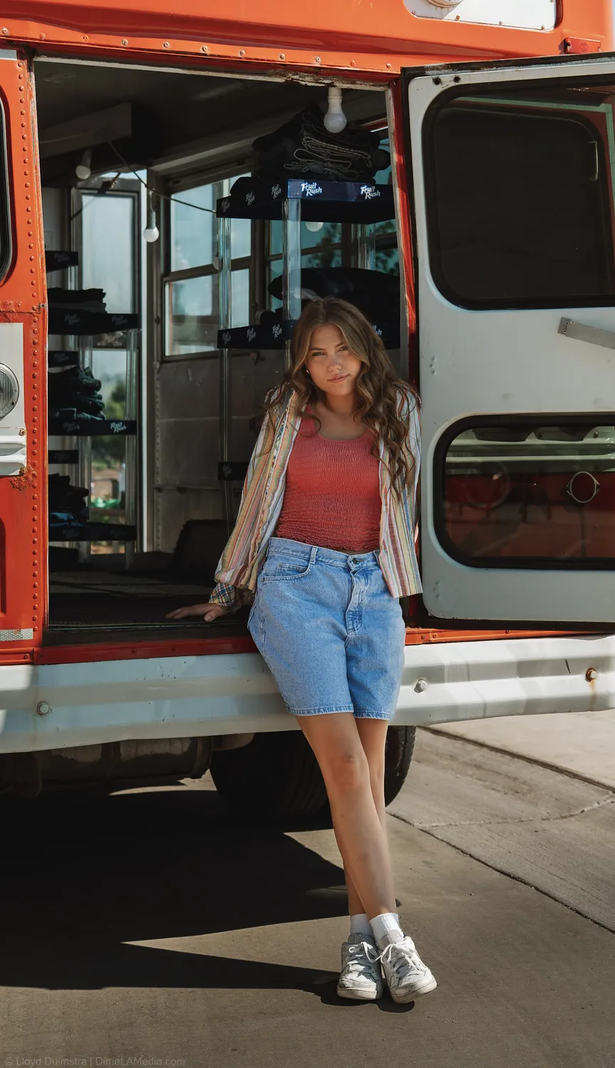 Maddie Theisen at the open back doors of the True Vintage bus in Sioux Falls