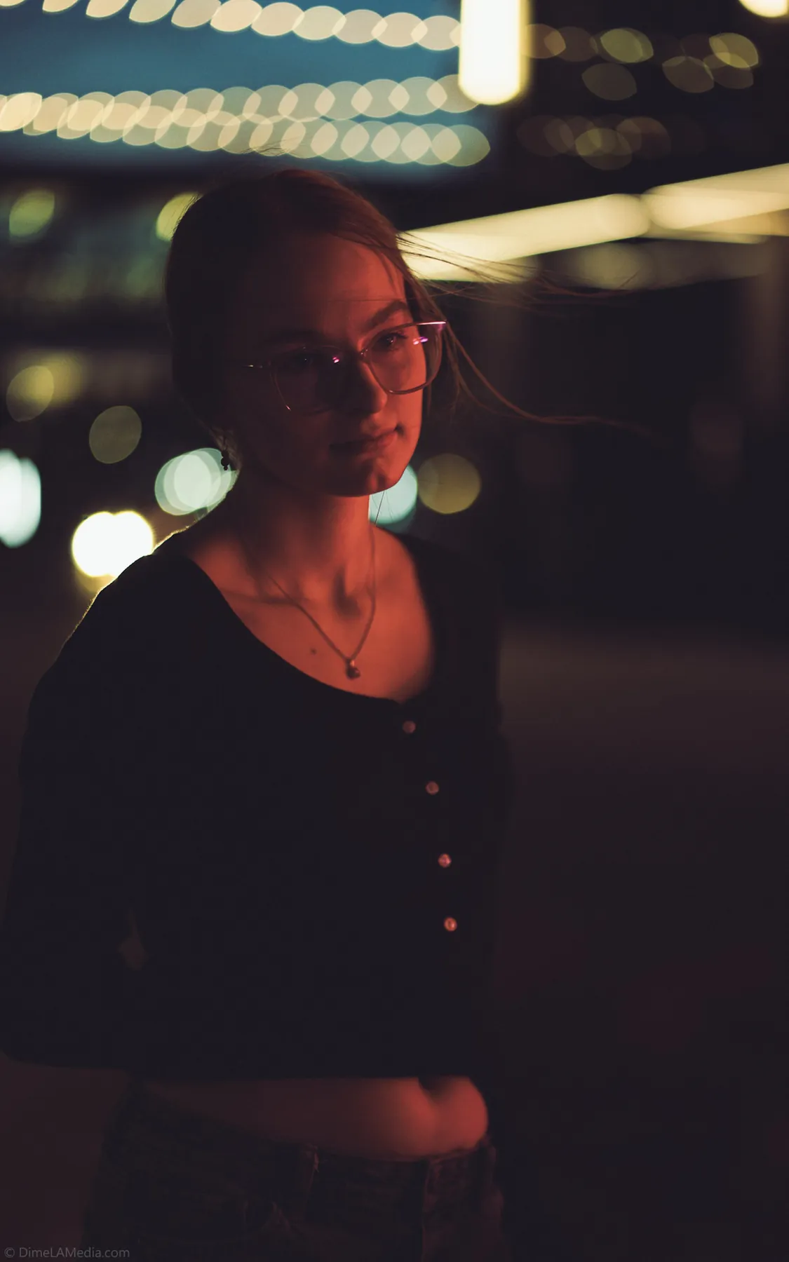 Syd Patzwald night senior portrait lit by neon