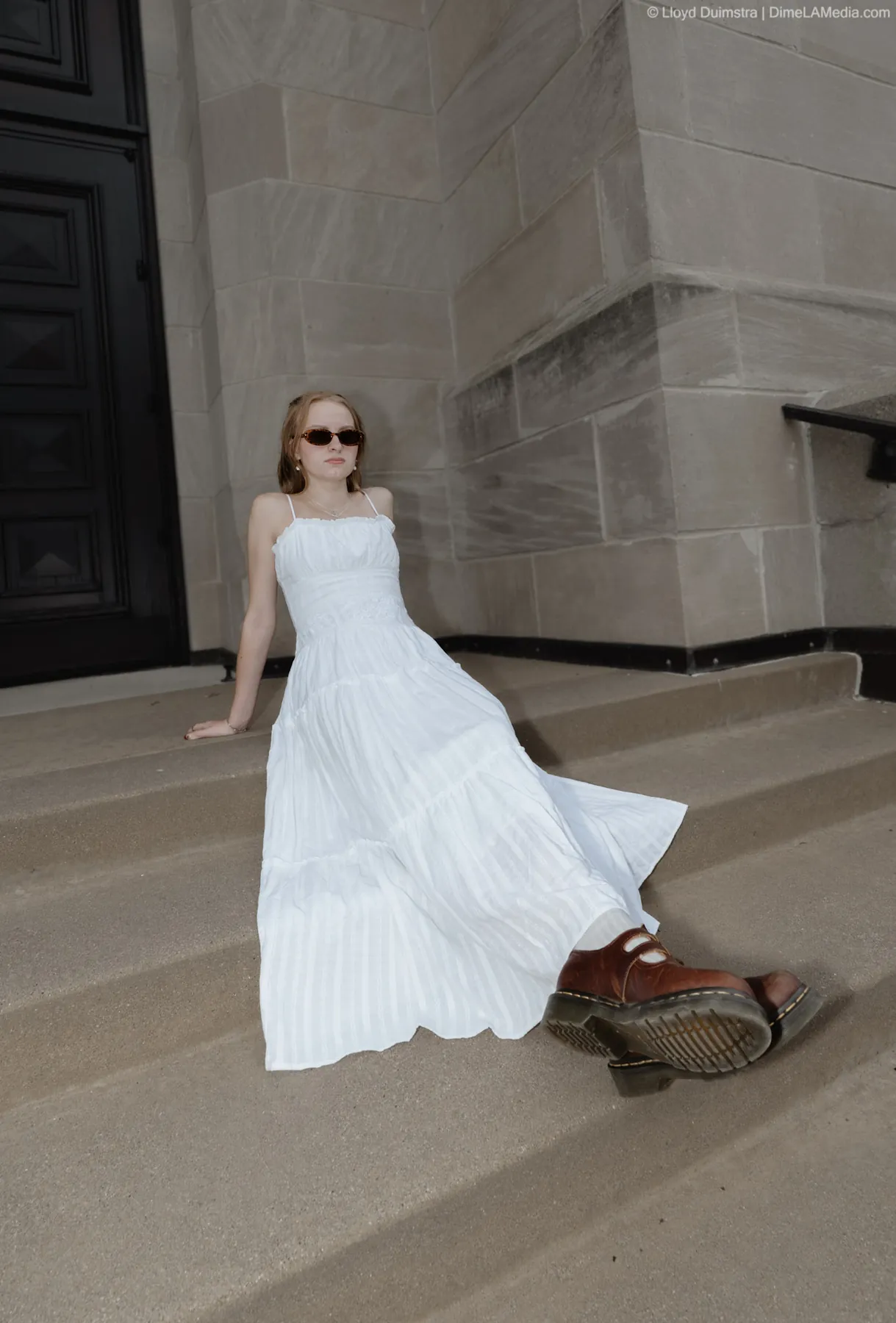 Syd Patzwald editorial senior portrait on stone steps, downtown Sioux Falls