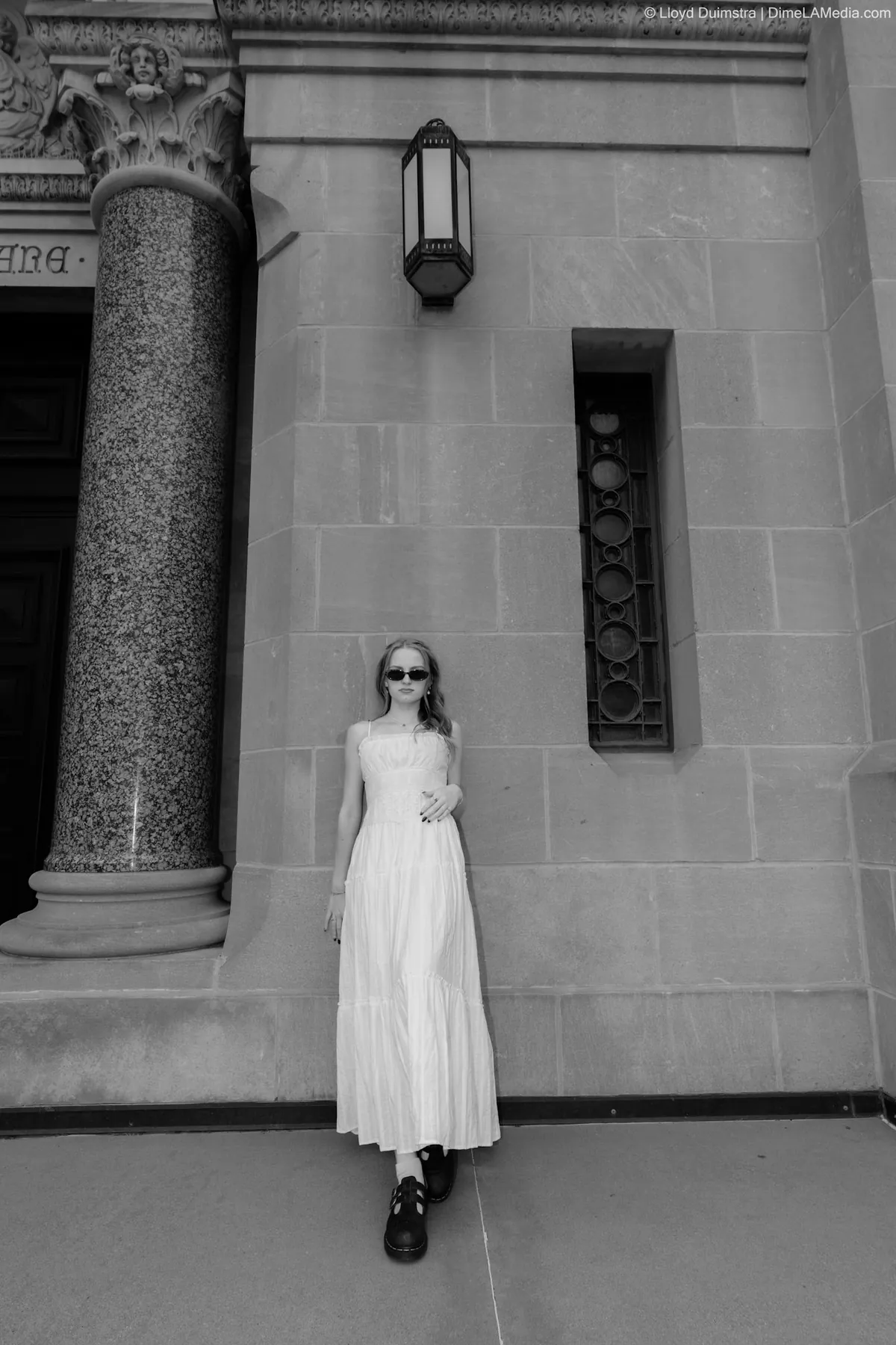 Syd Patzwald black and white senior portrait at a courthouse facade