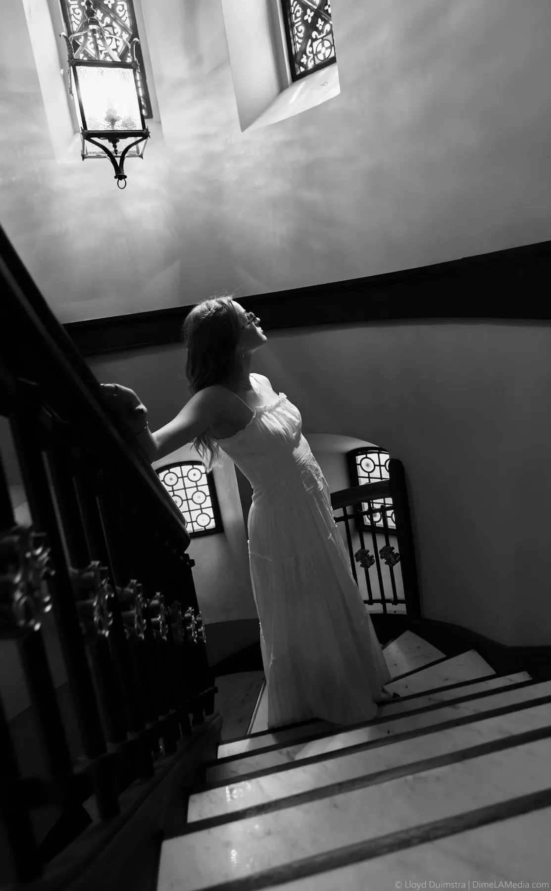 Syd Patzwald black and white senior portrait on a marble staircase