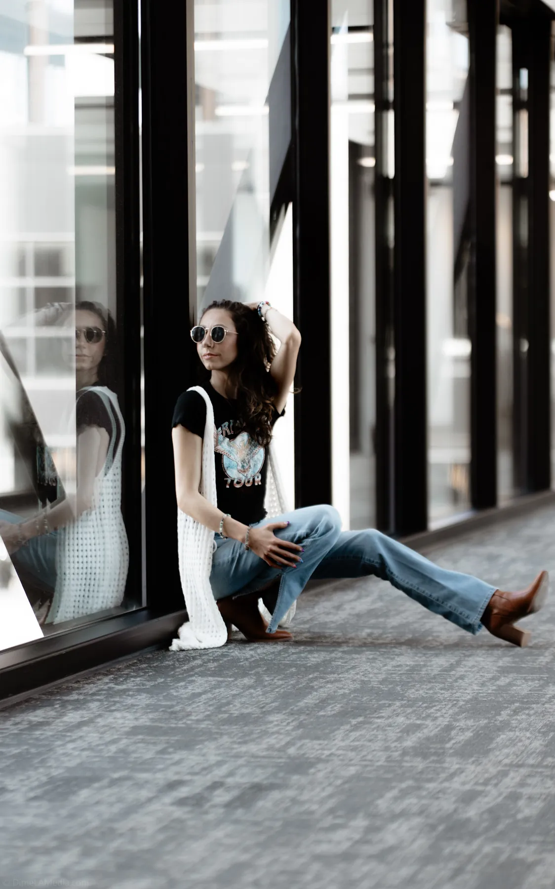 Senior portrait with window reflection in a downtown Sioux Falls skywalk