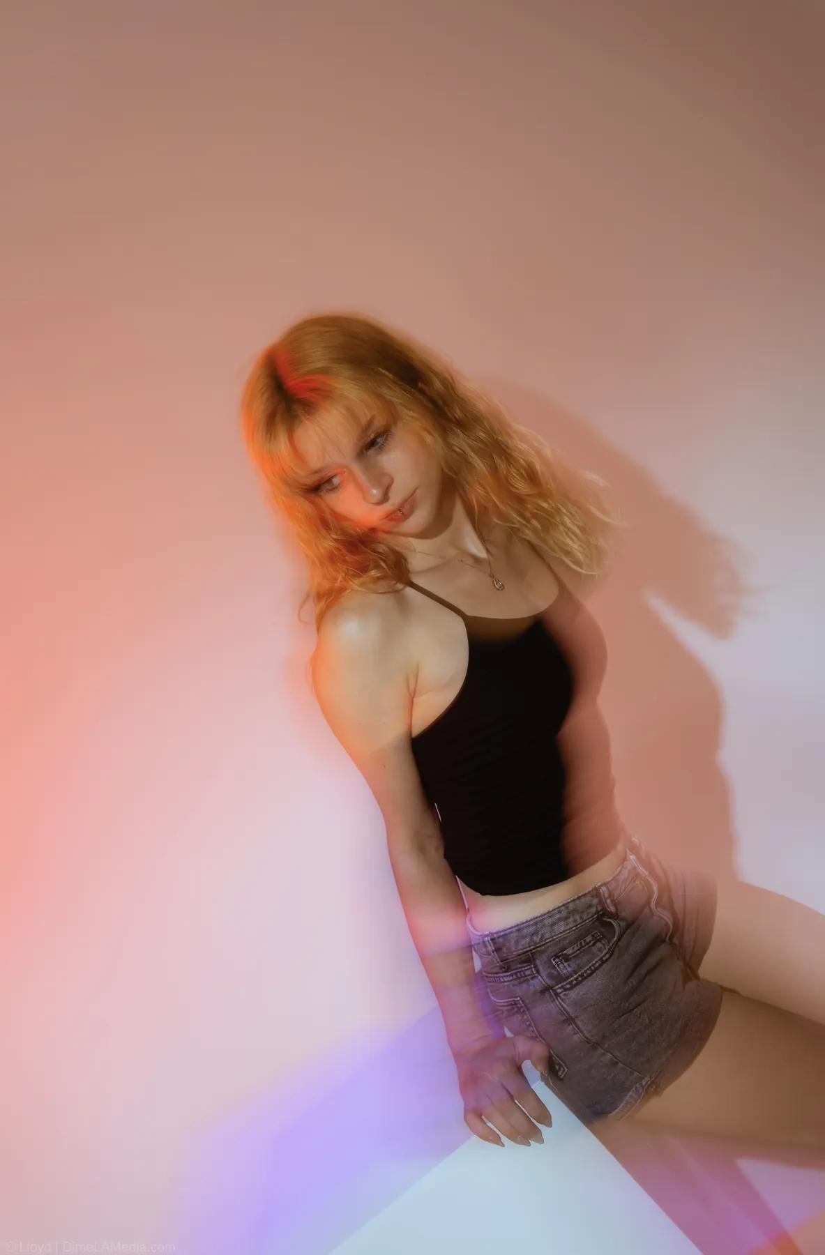 Studio portrait with colored gel light and lens flare, Sioux Falls SD
