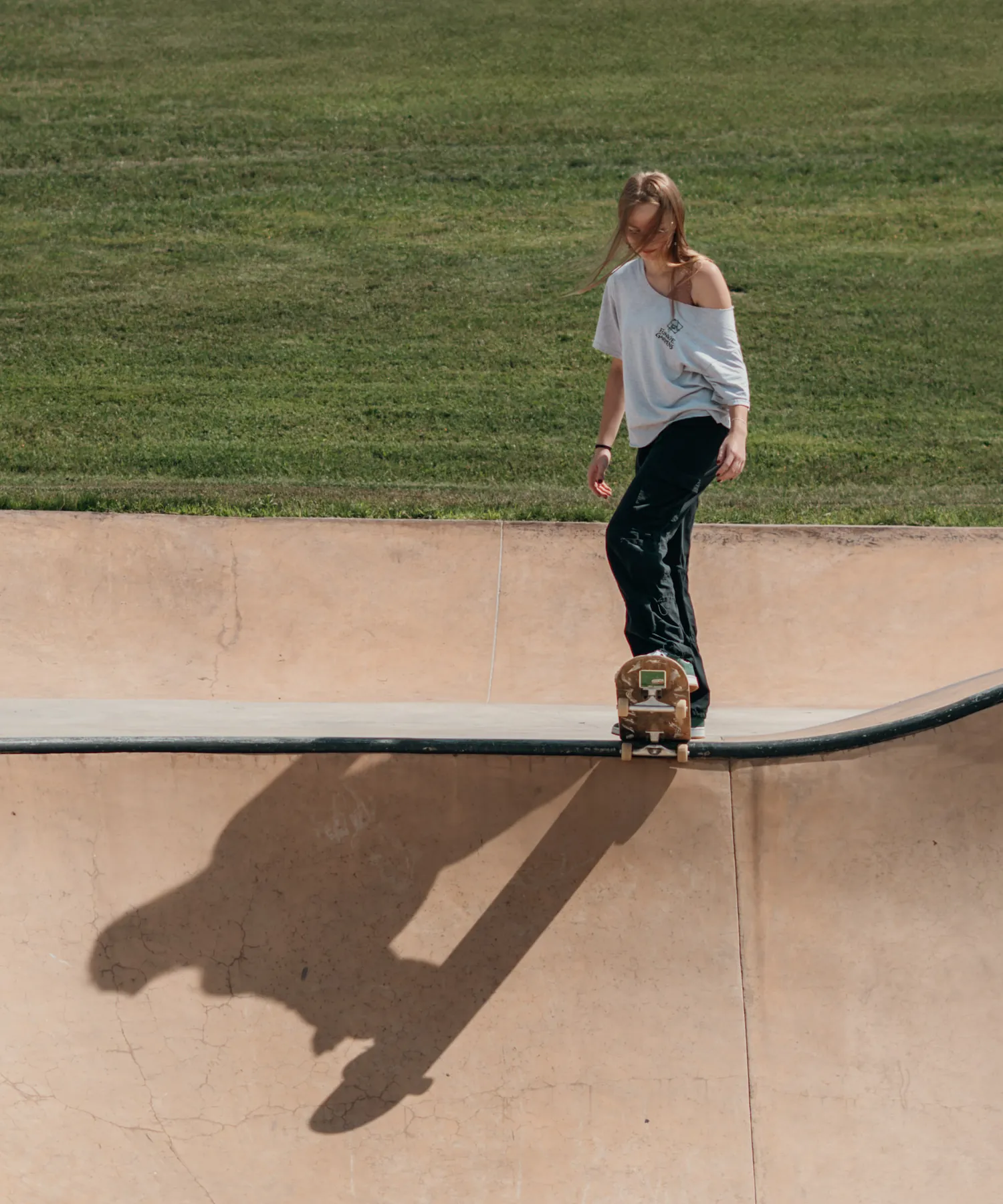 Skater sliding the bank with a long shadow
