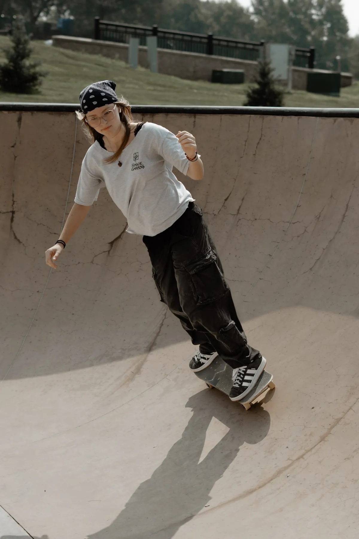 Skater cruising the deep bowl in a helmet