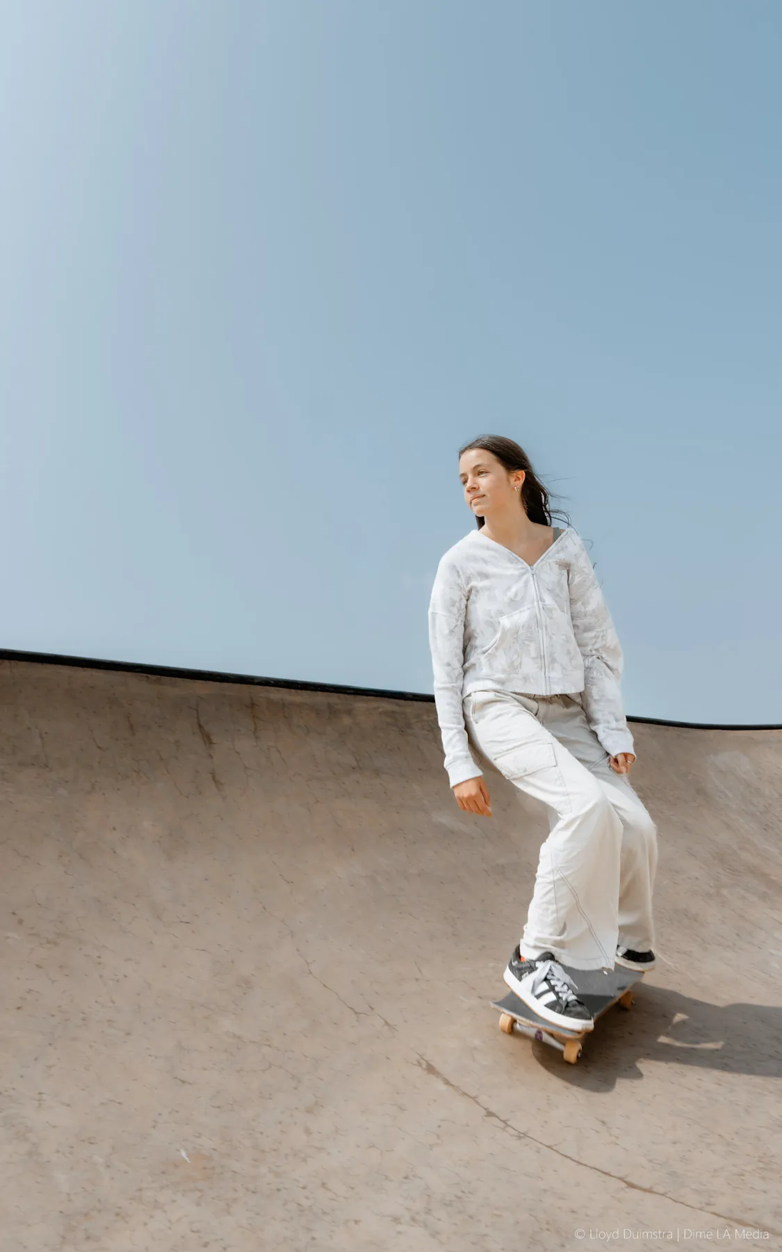 Skater rolling into the bowl on a summer afternoon