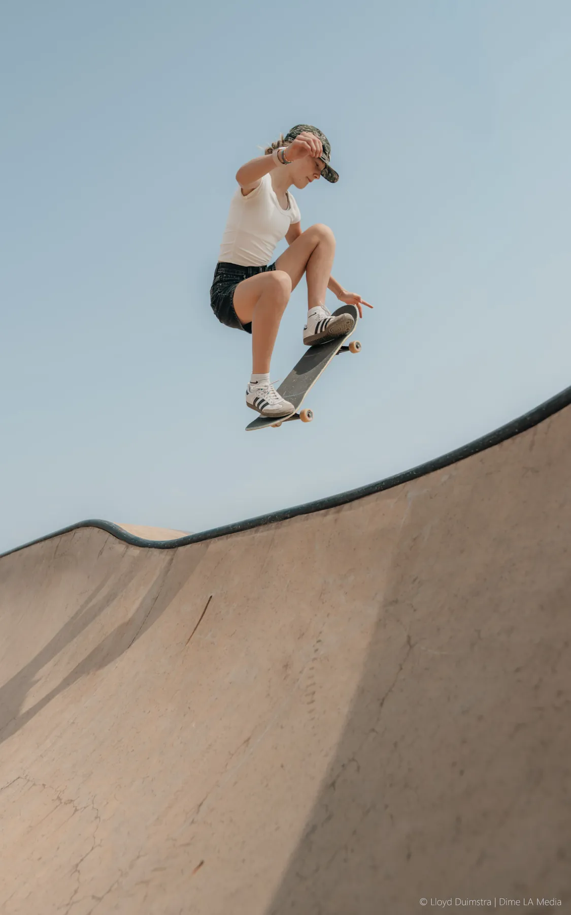 Mid-air grab over the skatepark hip