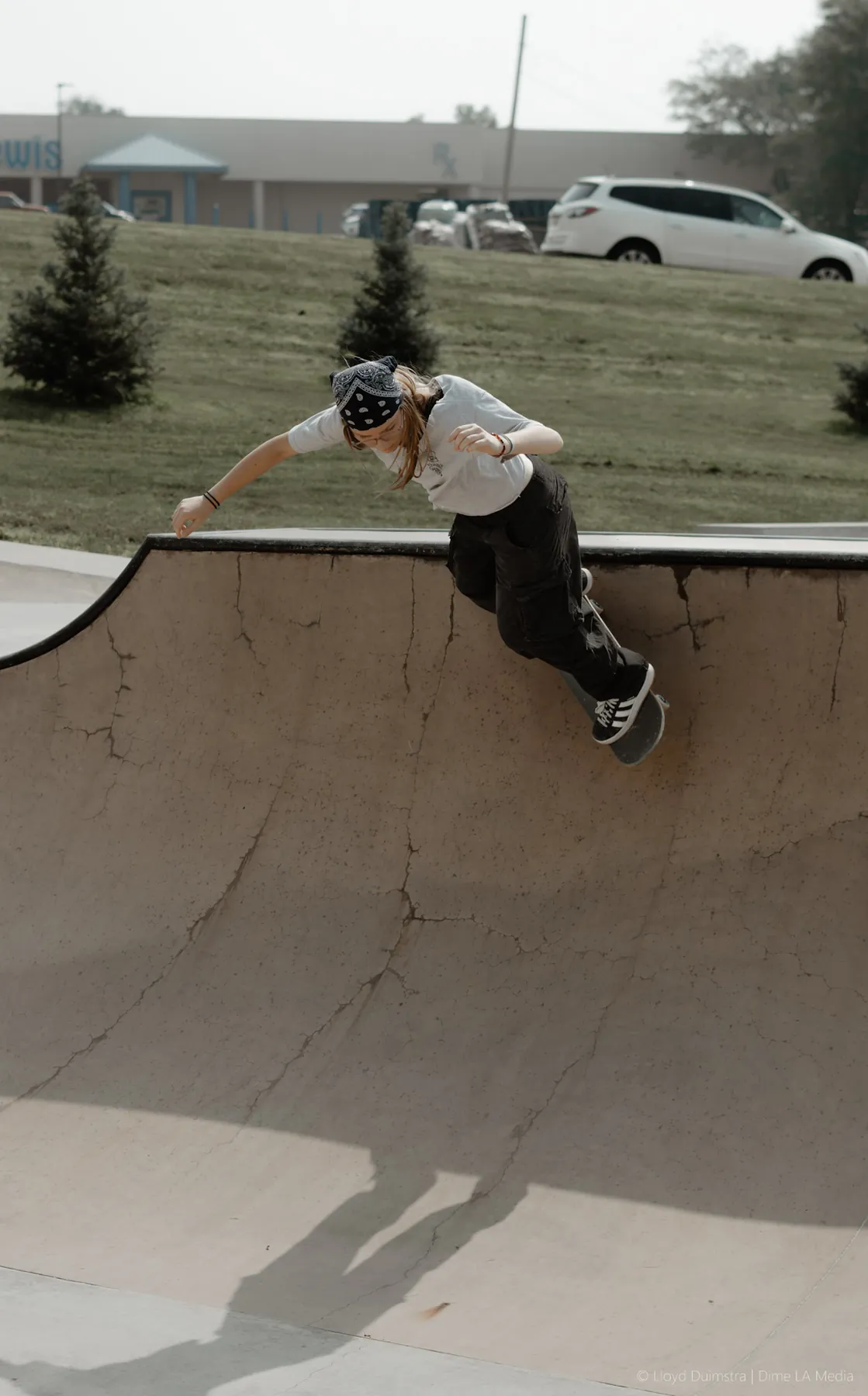 Skater grinding the bowl coping