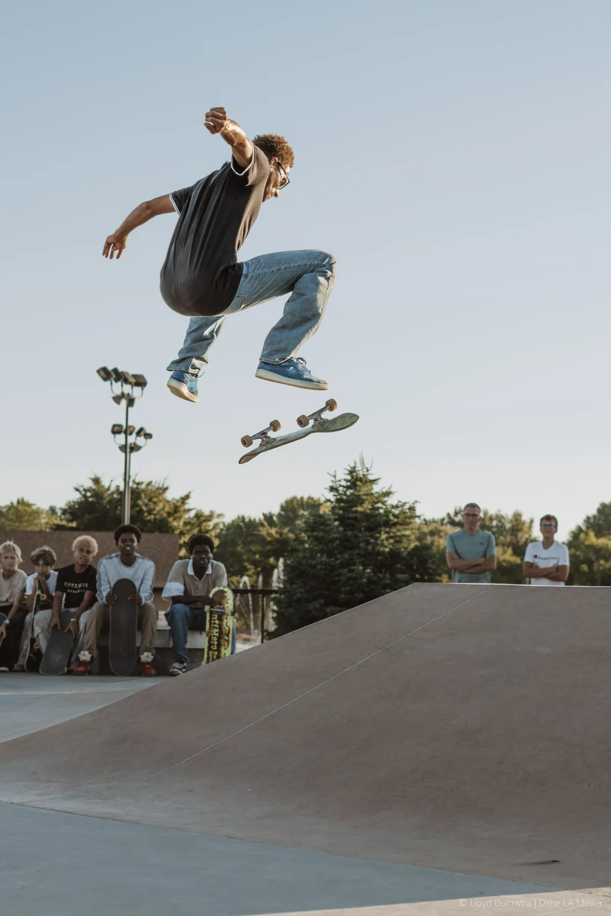 Skateboarder ollieing a gap during a session