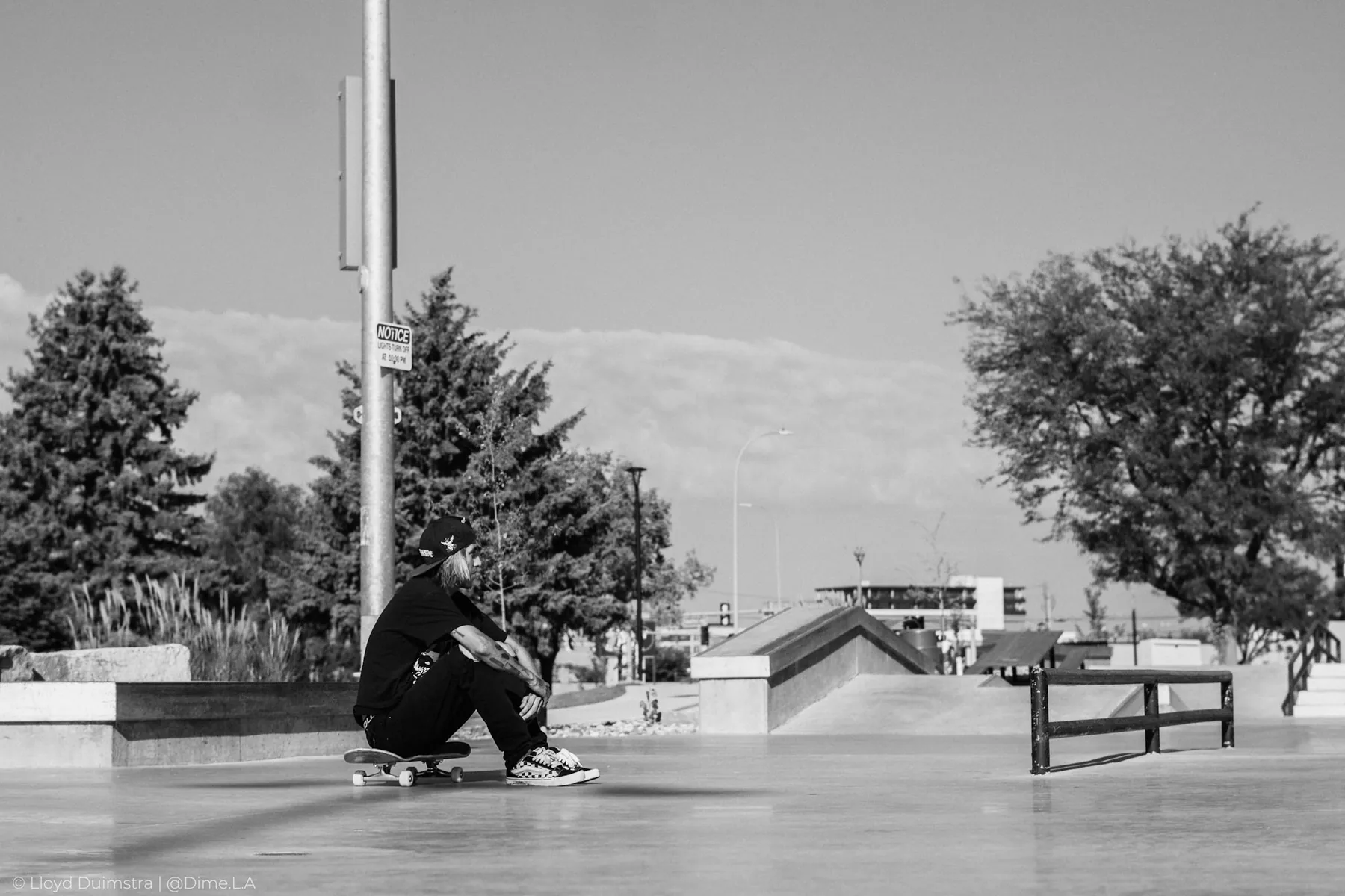 Black and white skateboarding photograph, street course