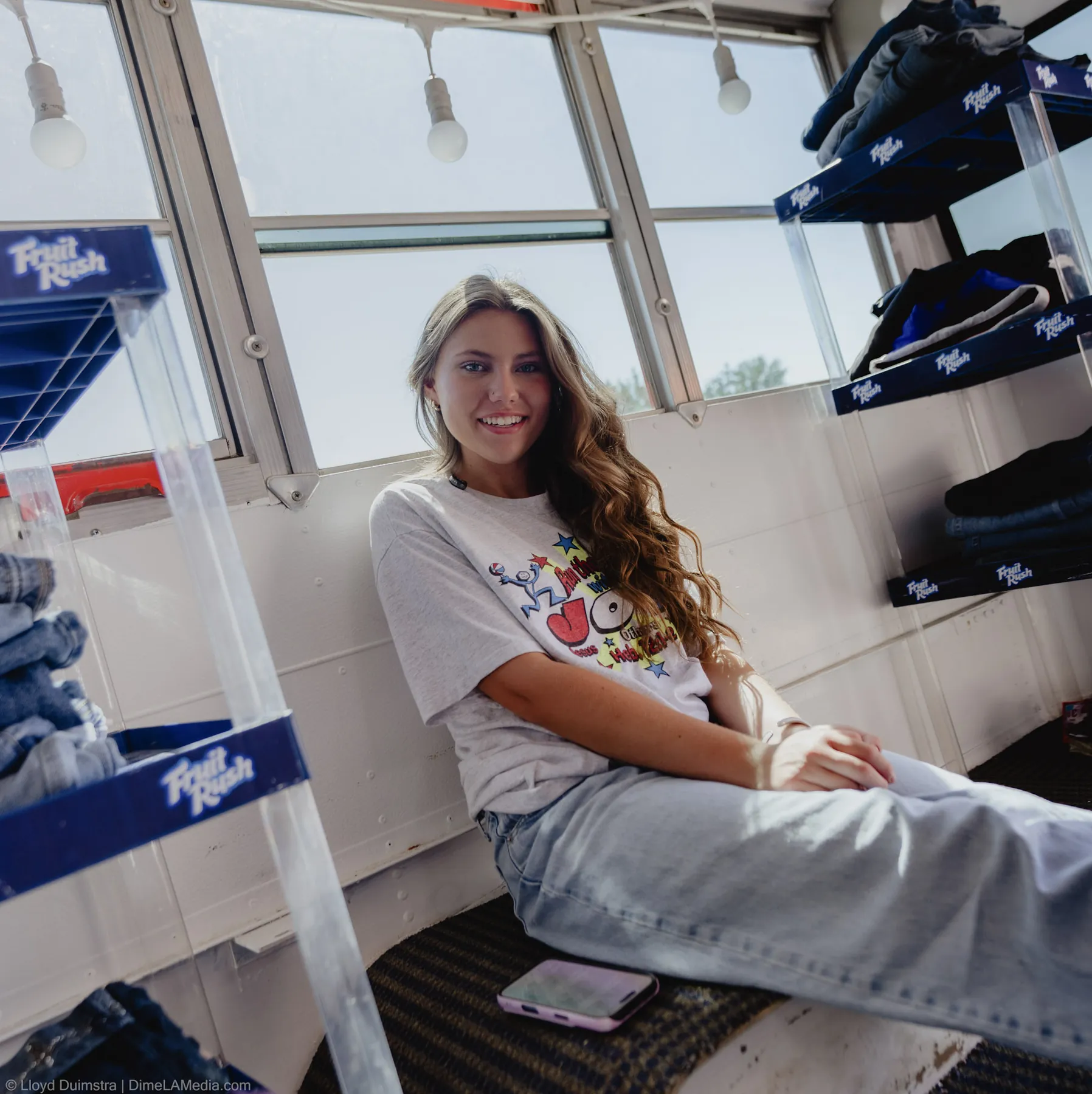 Maddie seated in the window bench of the True Vintage bus, Sioux Falls SD