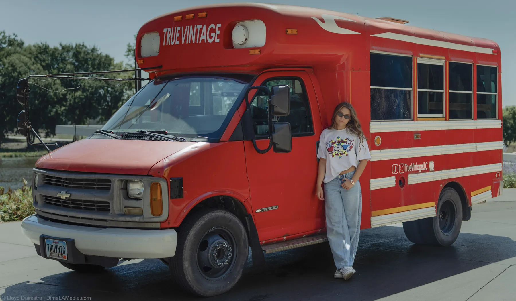 The red True Vintage LLC bus parked in the Steel District, Sioux Falls