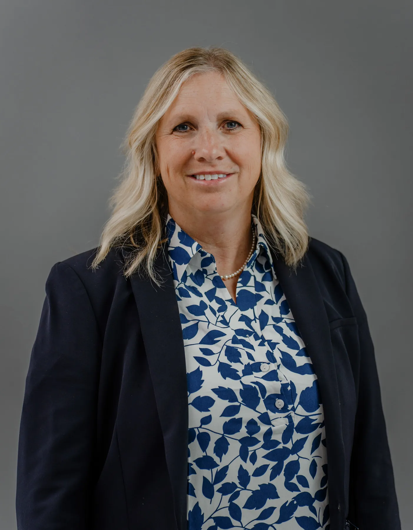 Professional headshot on a grey backdrop shot on location in Sioux Falls SD
