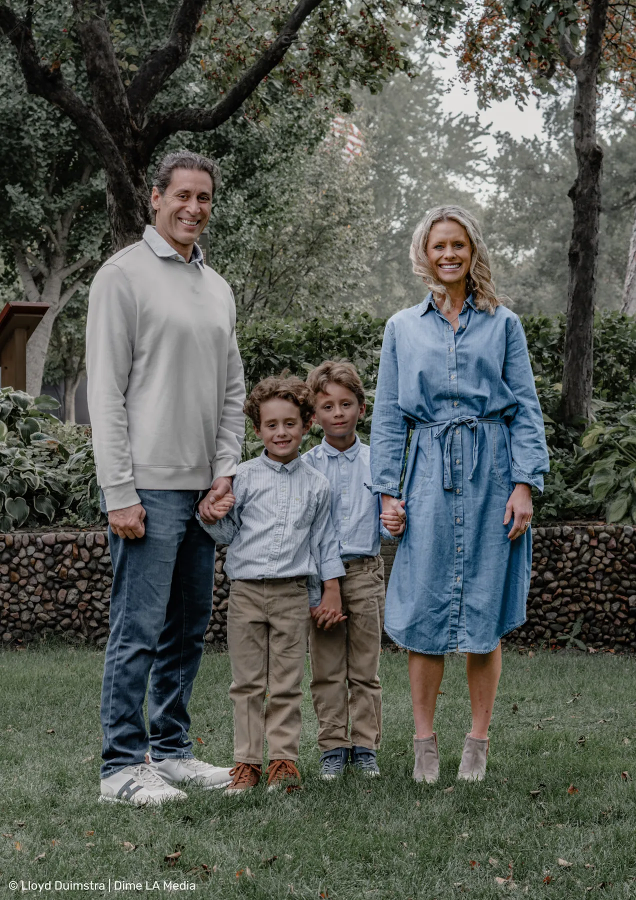 Relaxed family portrait on the park lawn
