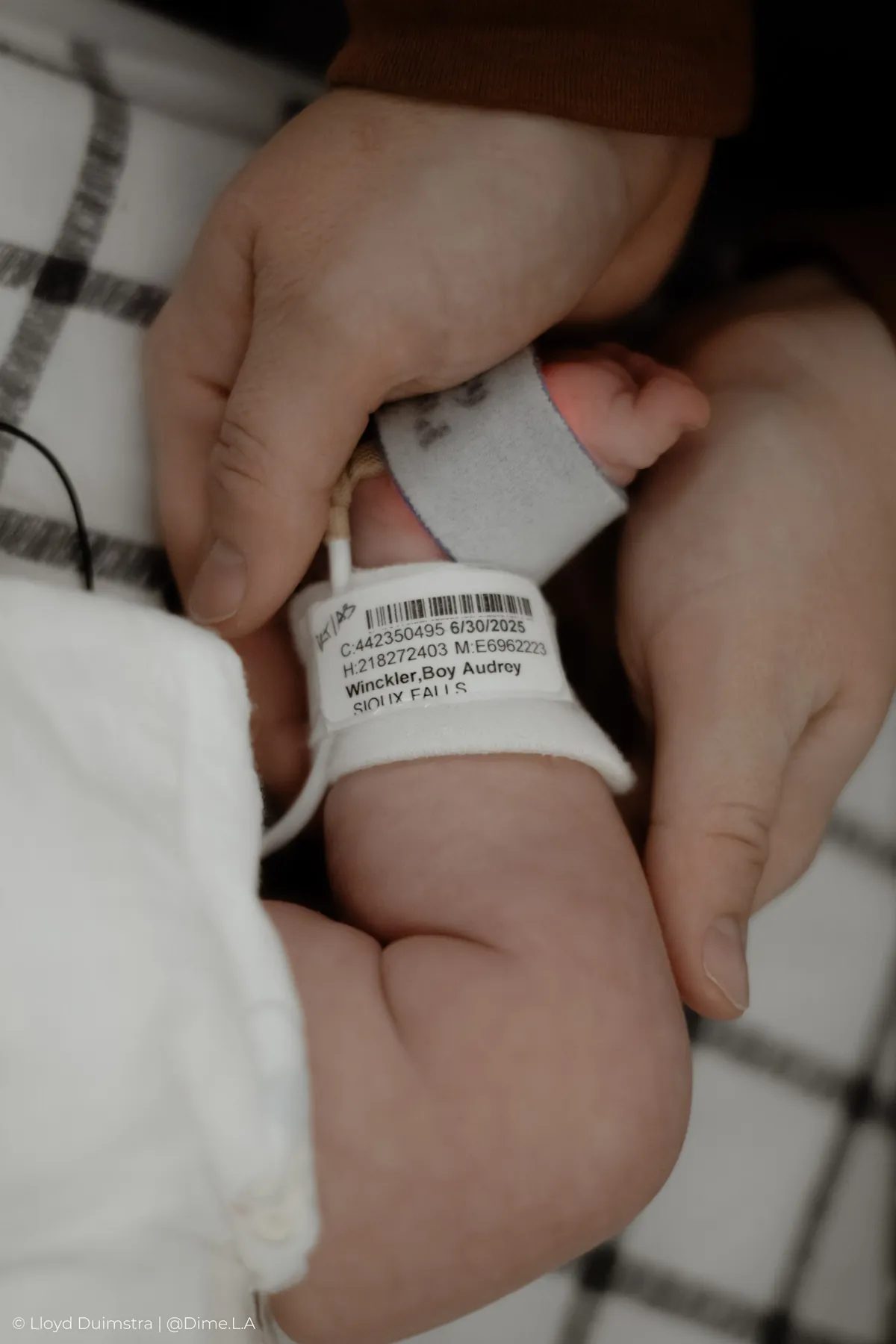 Hospital bracelet detail on a tiny NICU ankle