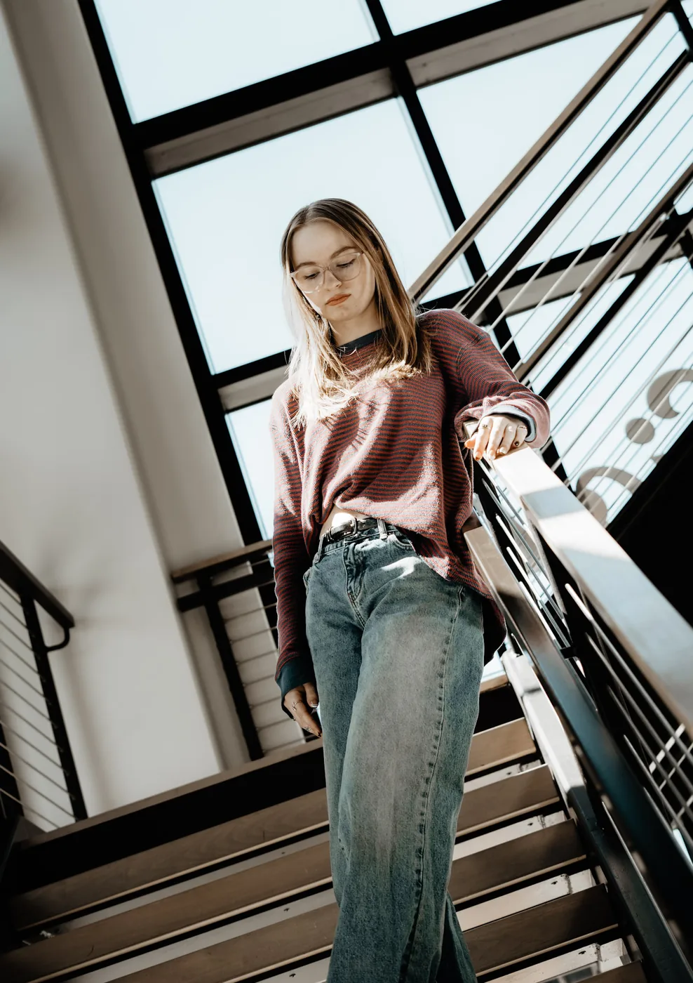 Syd Patzwald senior portrait on an indoor staircase, Sioux Falls SD