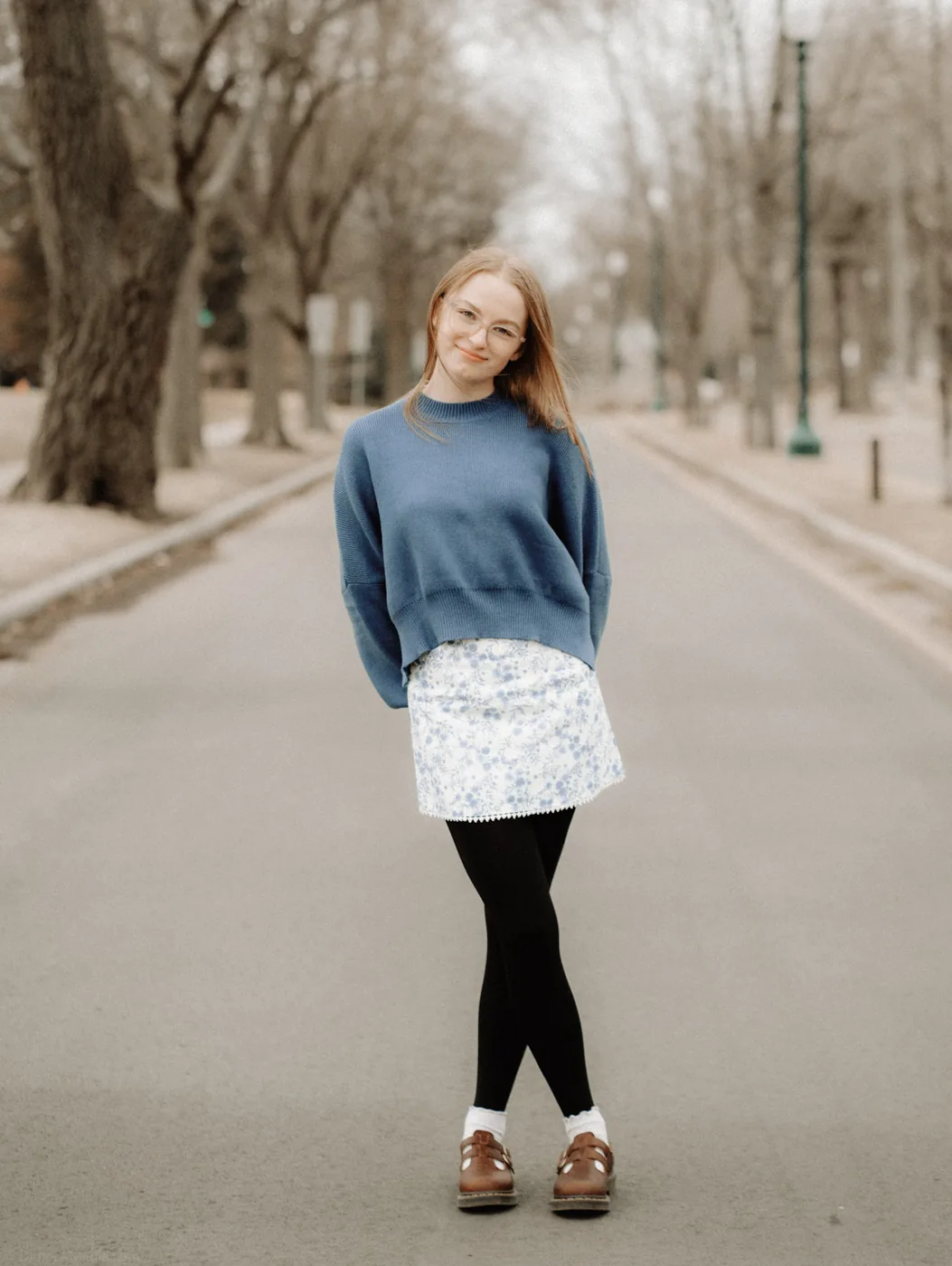 Syd Patzwald winter senior portrait on a tree-lined street