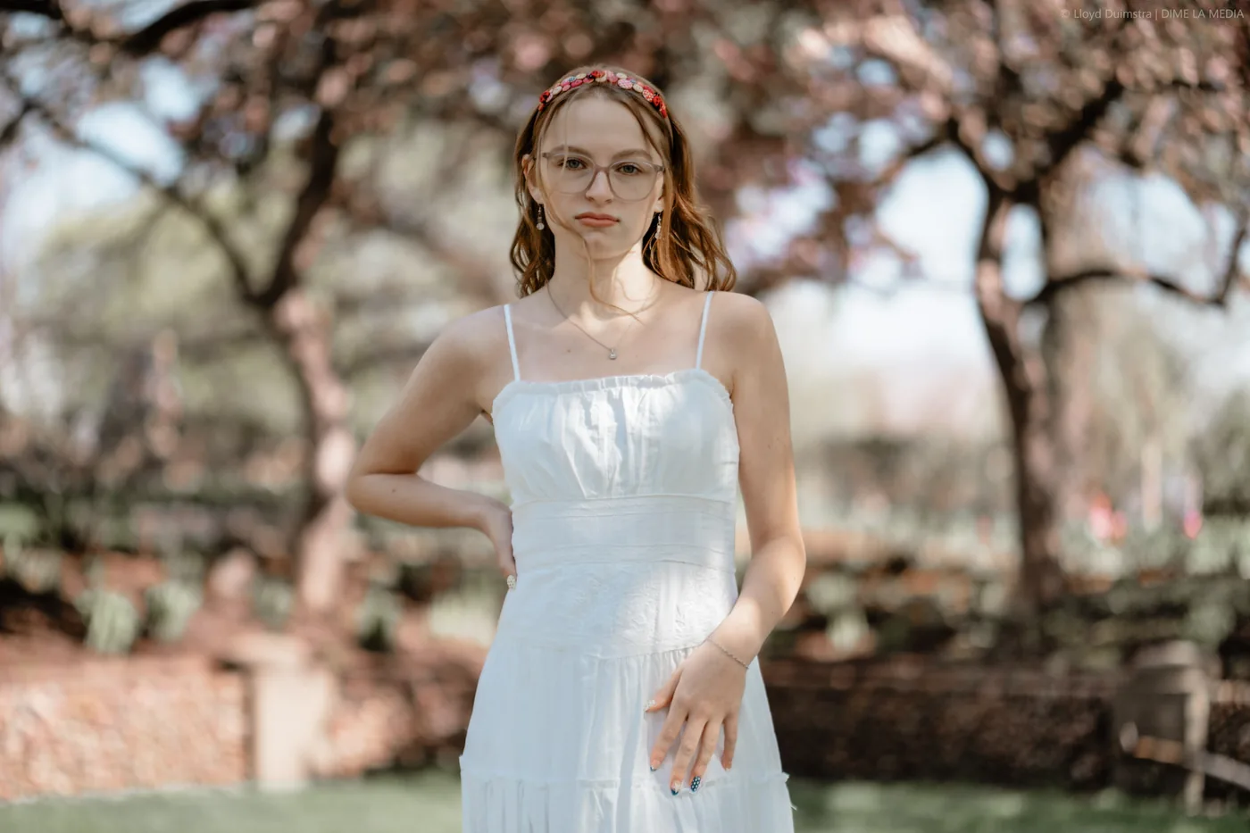 Syd Patzwald senior portrait among spring blossoms, Sioux Falls SD
