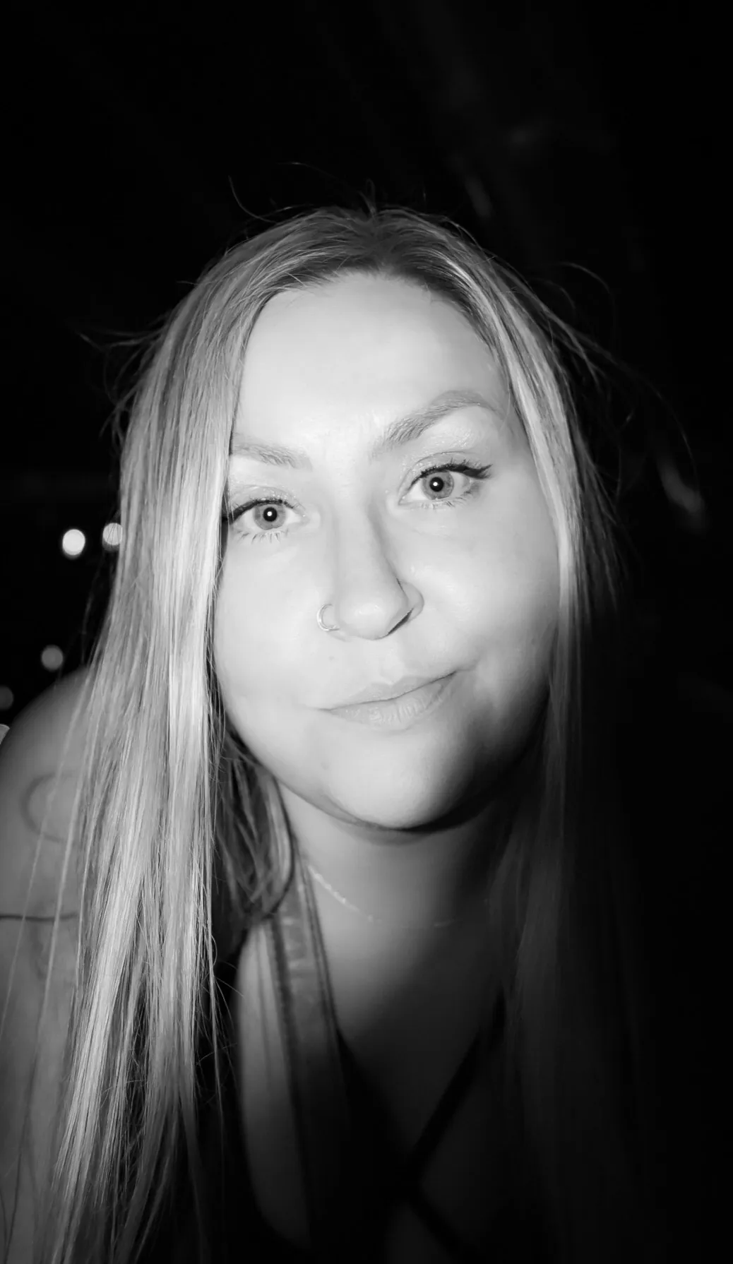 Black and white flash portrait, direct and candid