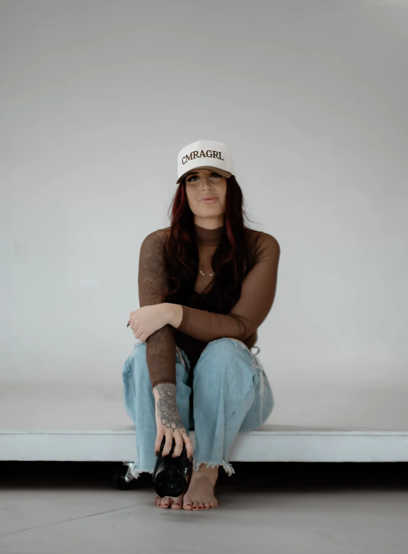 Relaxed branding portrait on a white modular couch