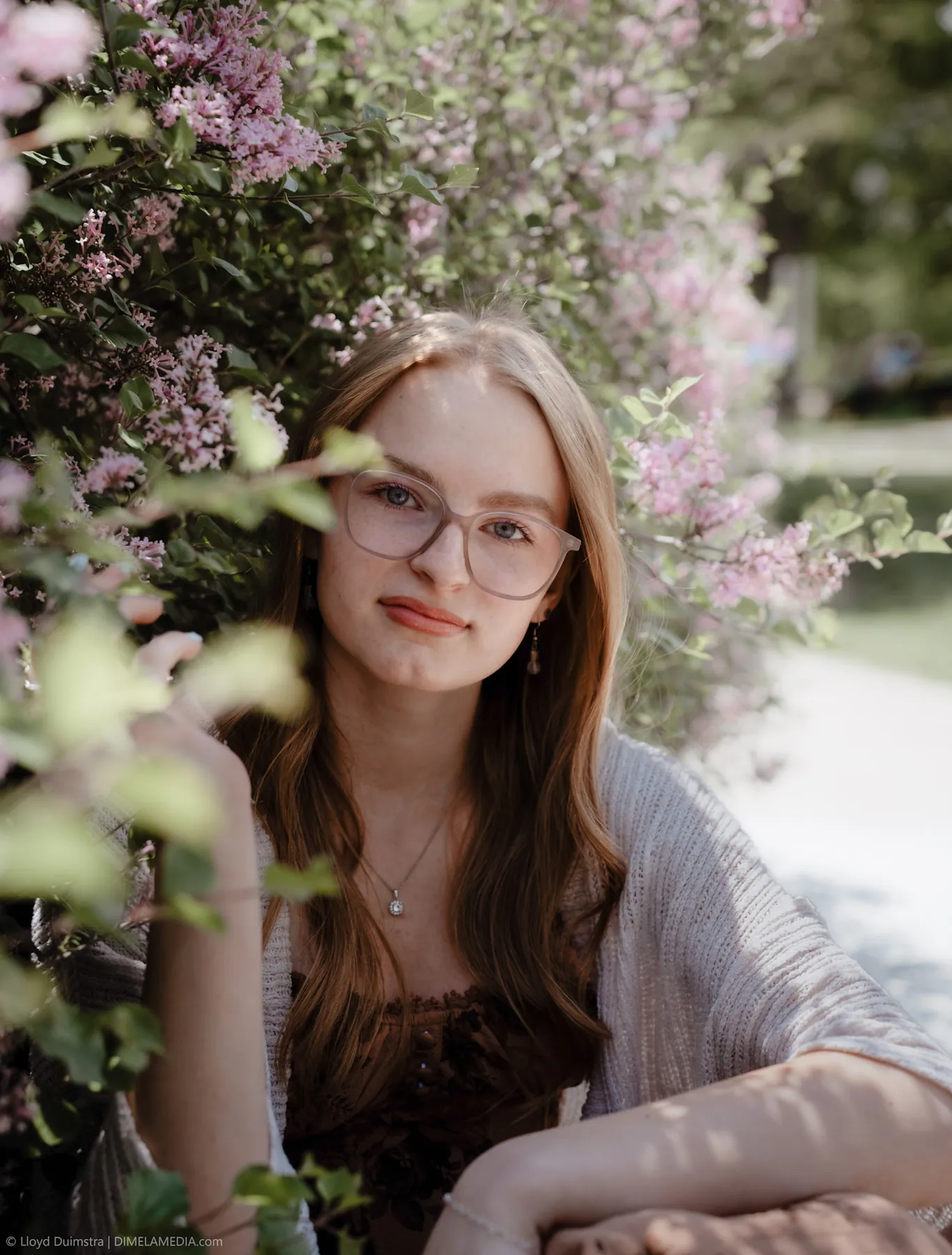 Syd Patzwald among lilac blooms in soft spring light