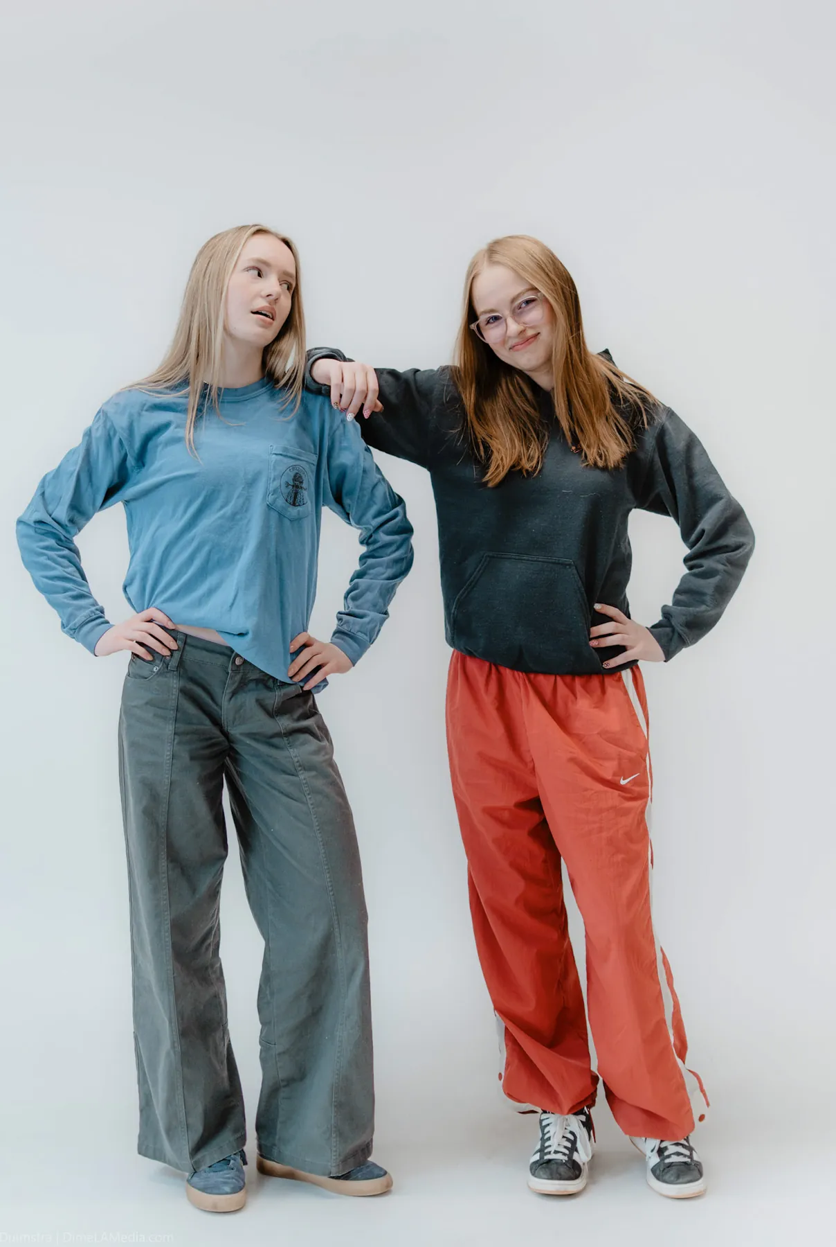 Two friends leaning into each other during a studio session