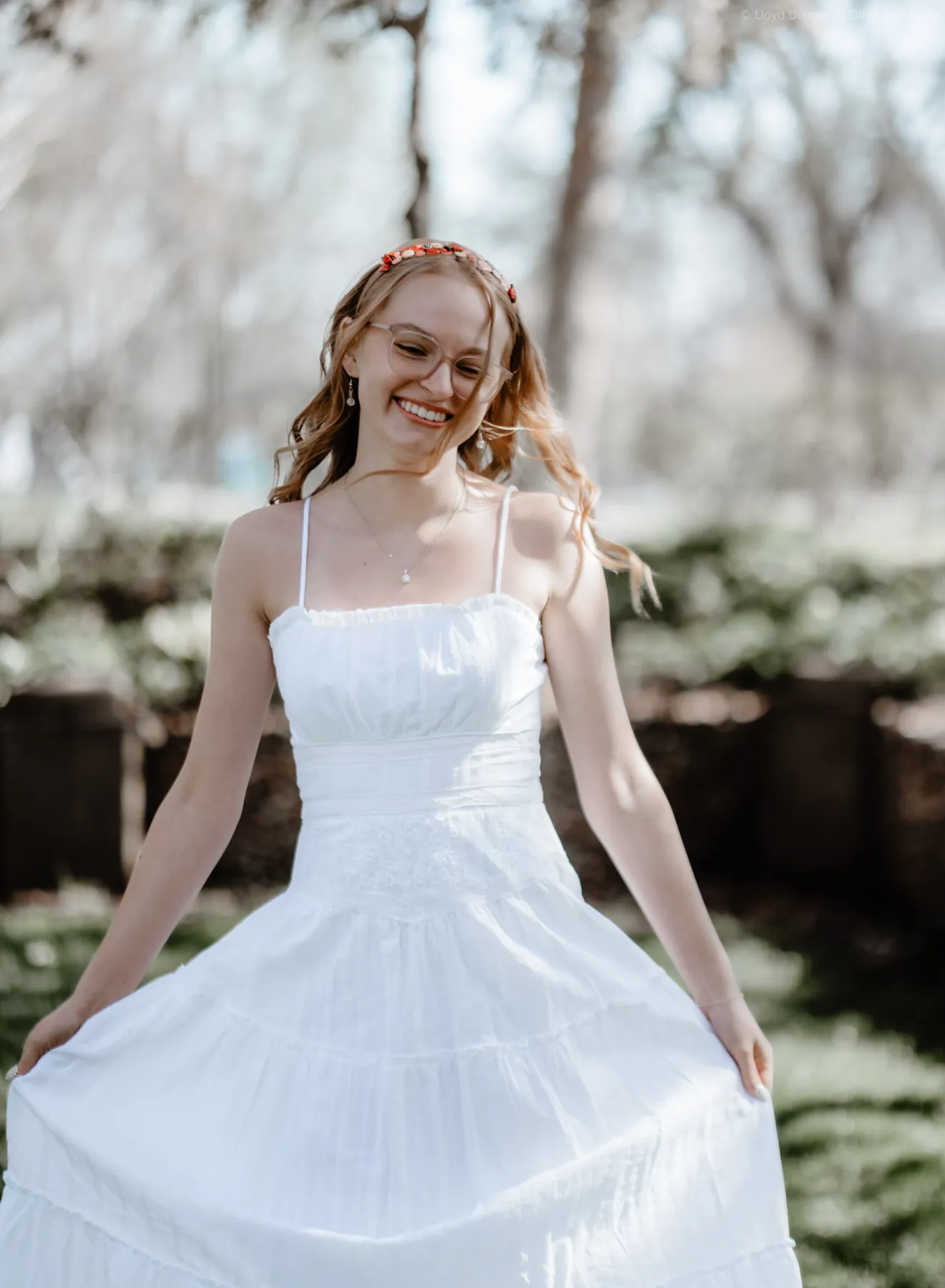 Syd Patzwald in a white dress in a Sioux Falls garden