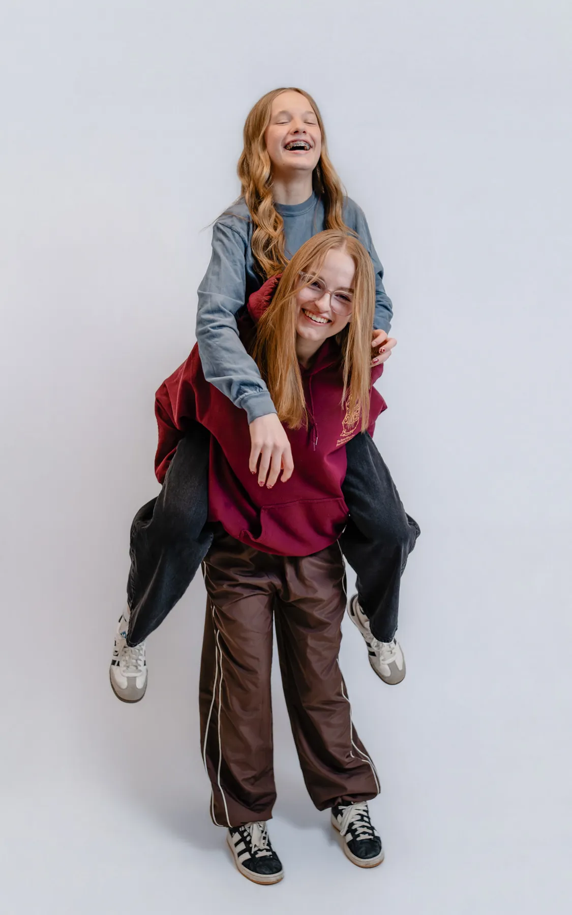 Piggyback studio portrait of Syd Patzwald and a friend