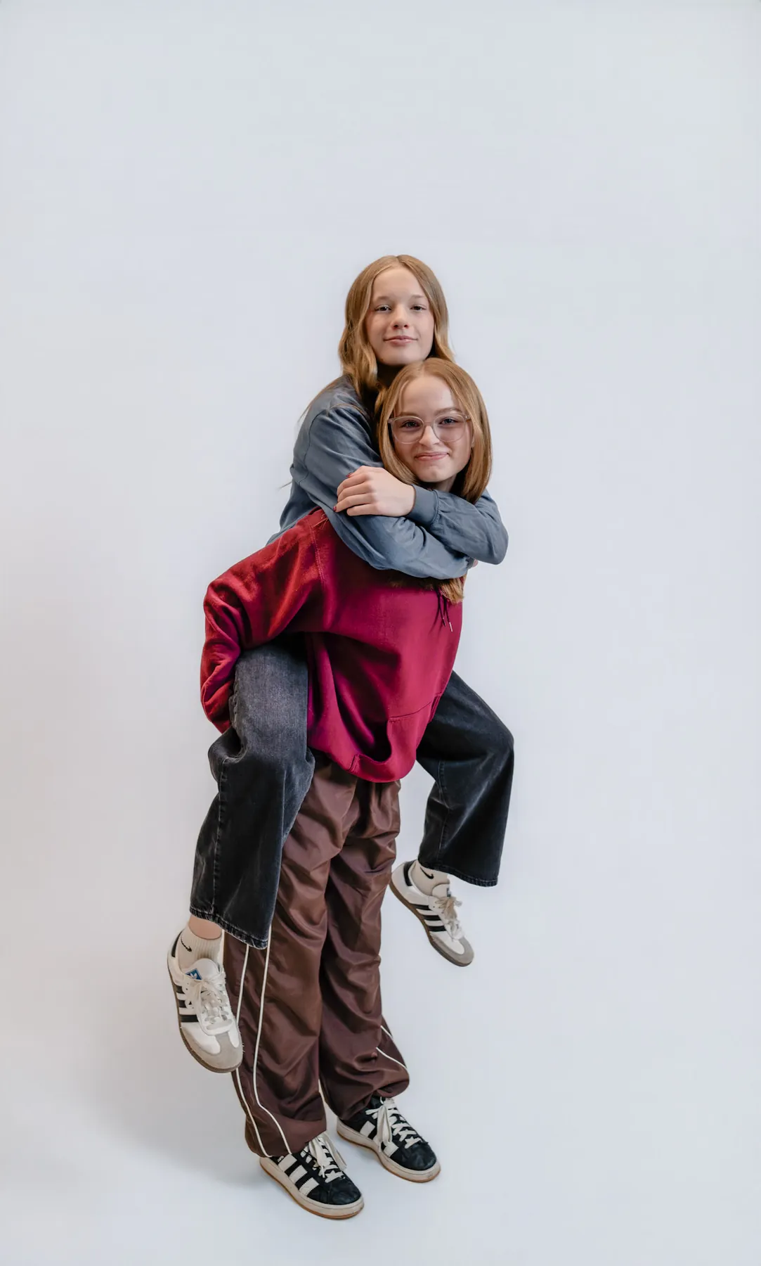 Syd Patzwald and a friend laughing through a piggyback in the studio, Dime LA Media Sioux Falls