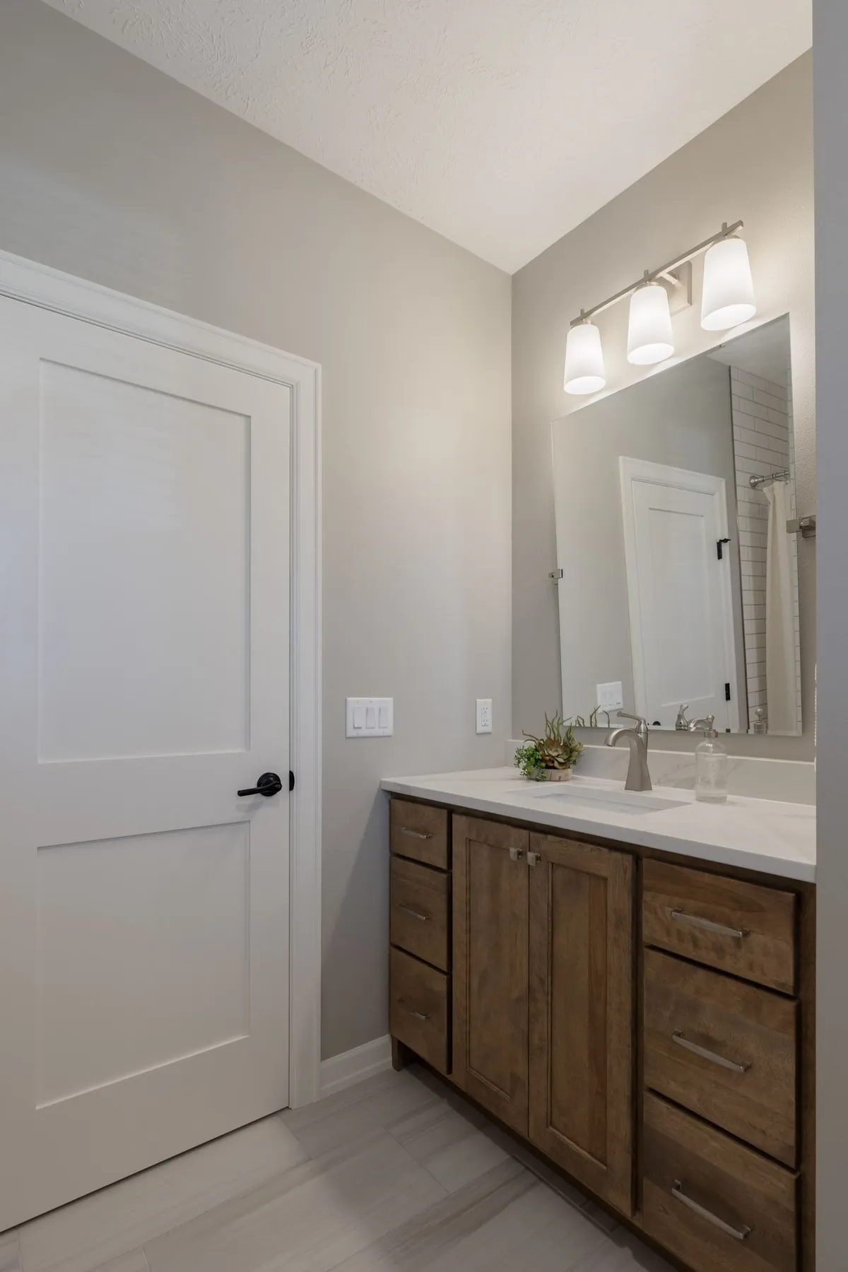 Bathroom with vanity and tile detail, real estate photography Sioux Falls SD