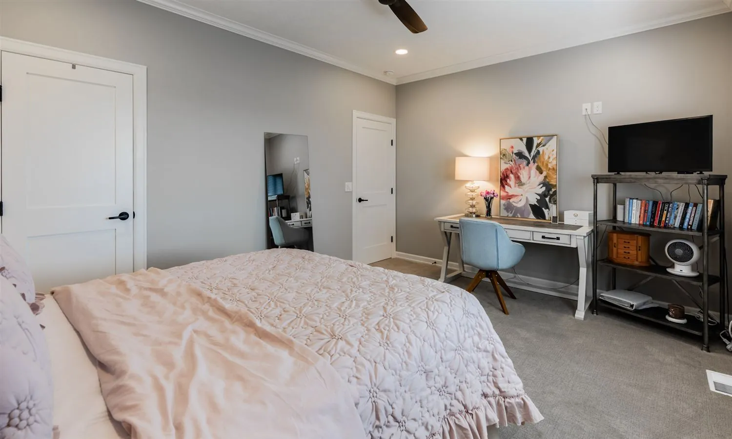 Bedroom with a writing desk and shelving, real estate photography Sioux Falls SD