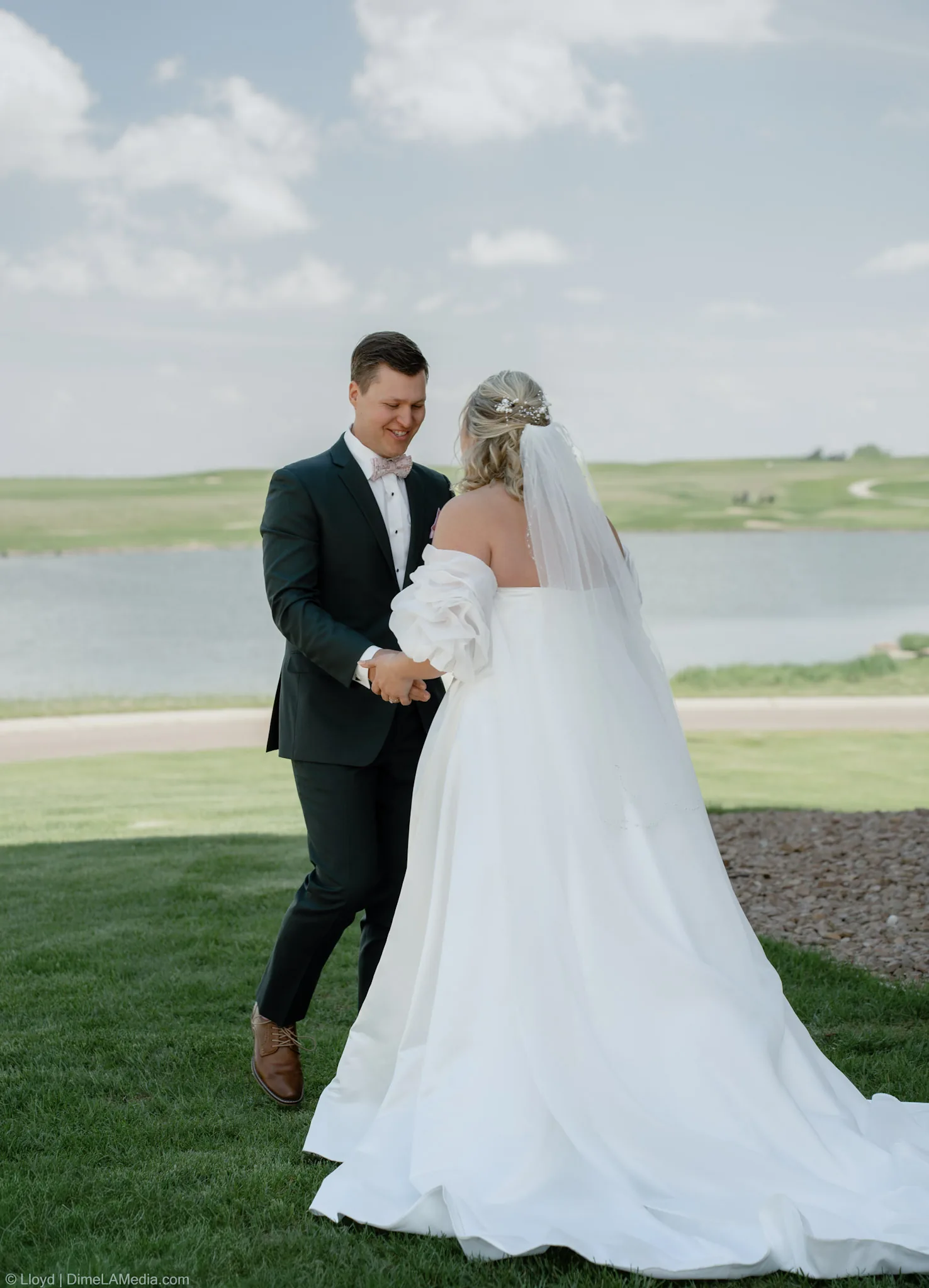 Groom reaching for his bride's hands the instant he turns around at the first look