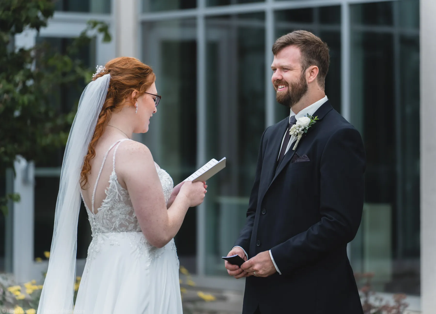 Bride reading her vows to the groom outdoors