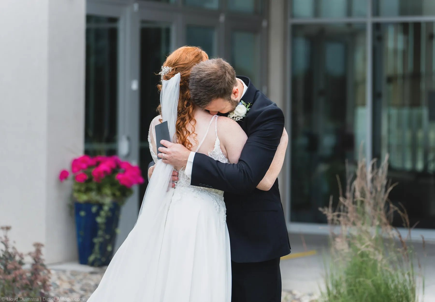 Couple embracing outdoors after the first look