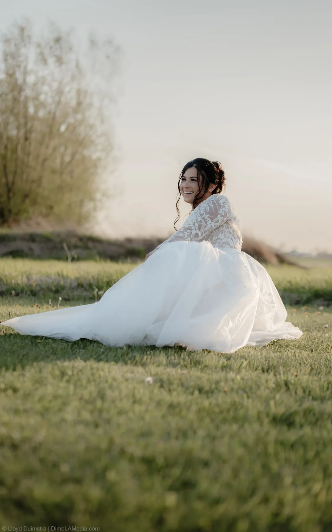 Bride seated in a golden field at sunset, Sioux Falls SD